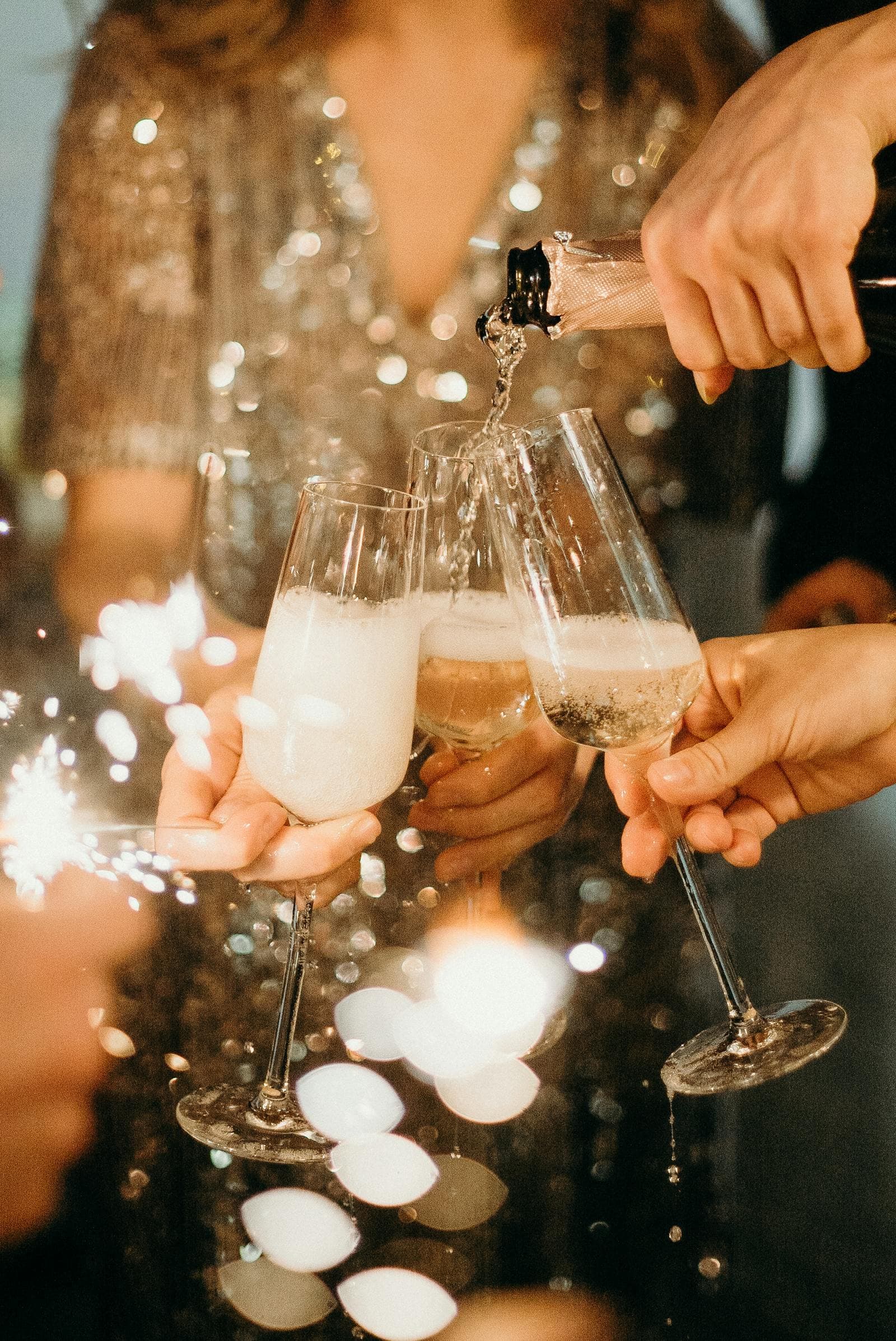 Champagne celebration with sparklers and golden ambiance