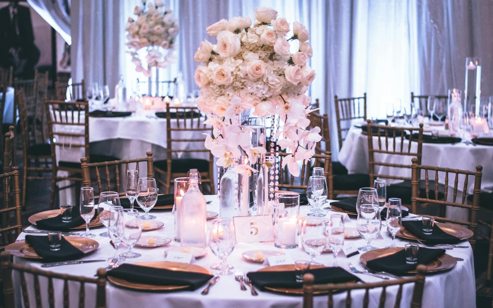 Elegant event table setting with floral centerpiece